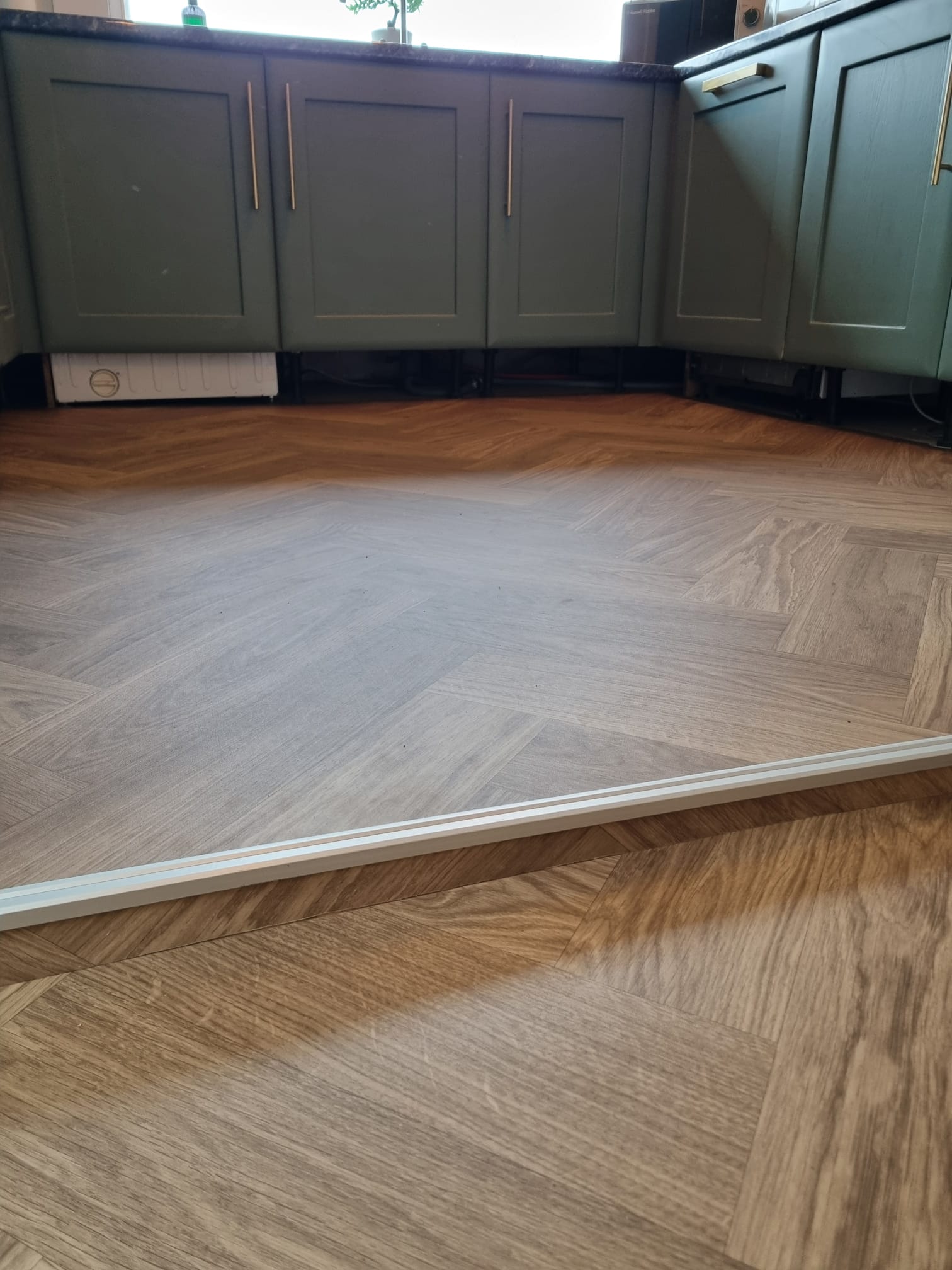 Herrigbone Sheet Vinyl Floor Fitting in Leeds home kitchen and hallway2 Herrigbone Sheet Vinyl Floor Fitting in Leeds home kitchen and hallway2