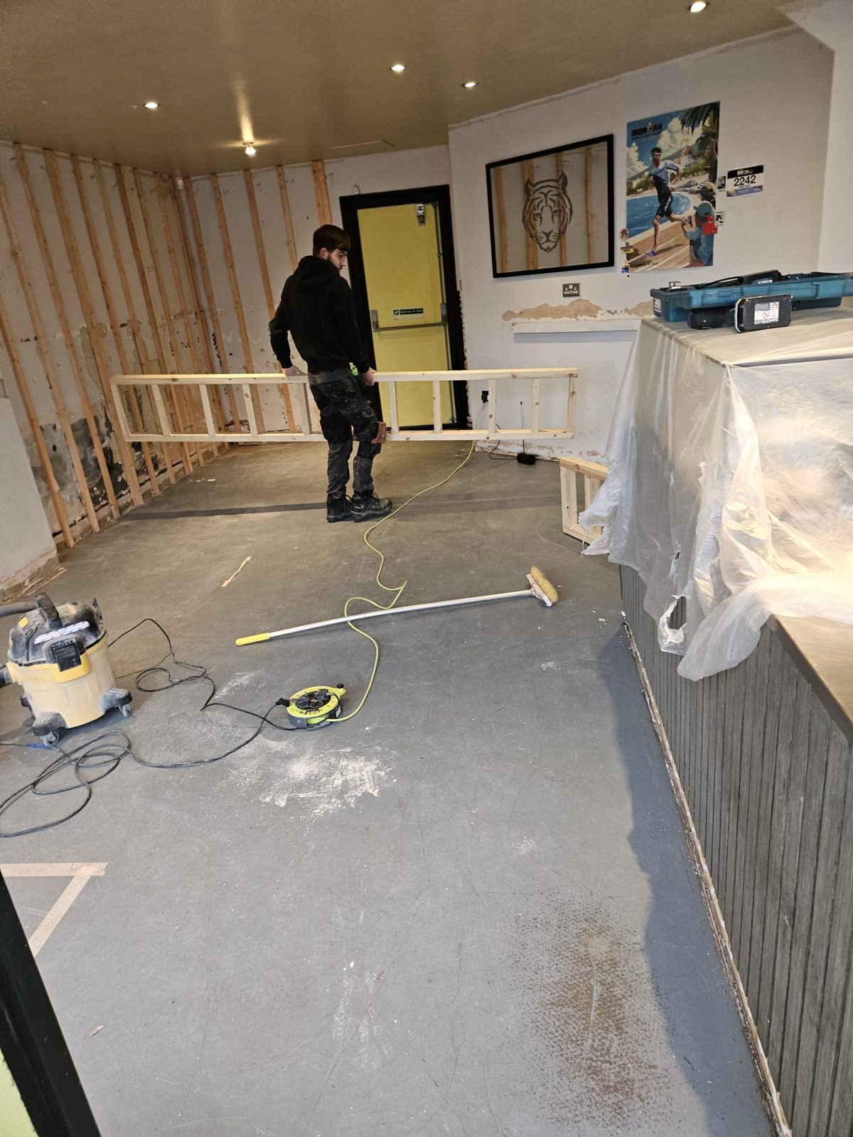 Café floor stripped back to the original subfloor before new flooring
