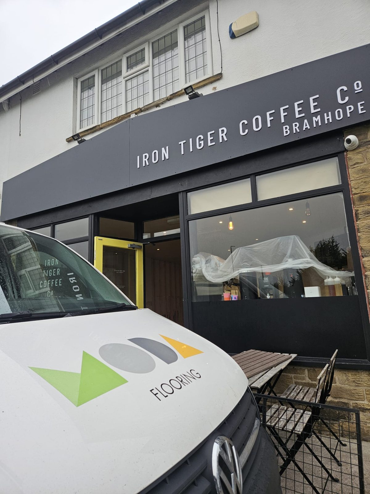 Moda Flooring van outside the Iron Tiger Coffee Co shopfront in Bramhope